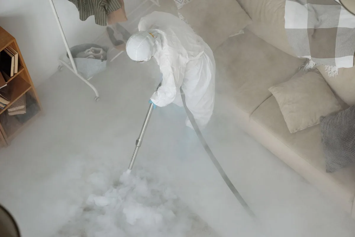 Biohazard cleanup technician in protective equipment, Fillmore, UT